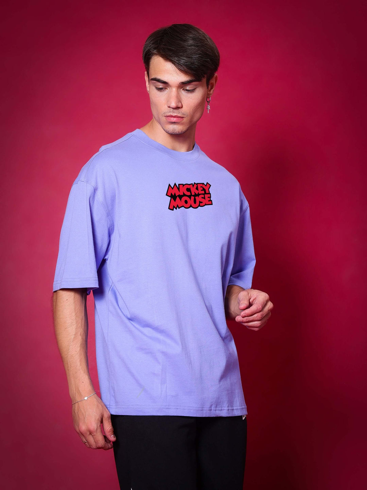 Man wearing DUDS MOUSE OVER-SIZED T-SHIRT PERIWINKLE with Mickey Mouse logo.