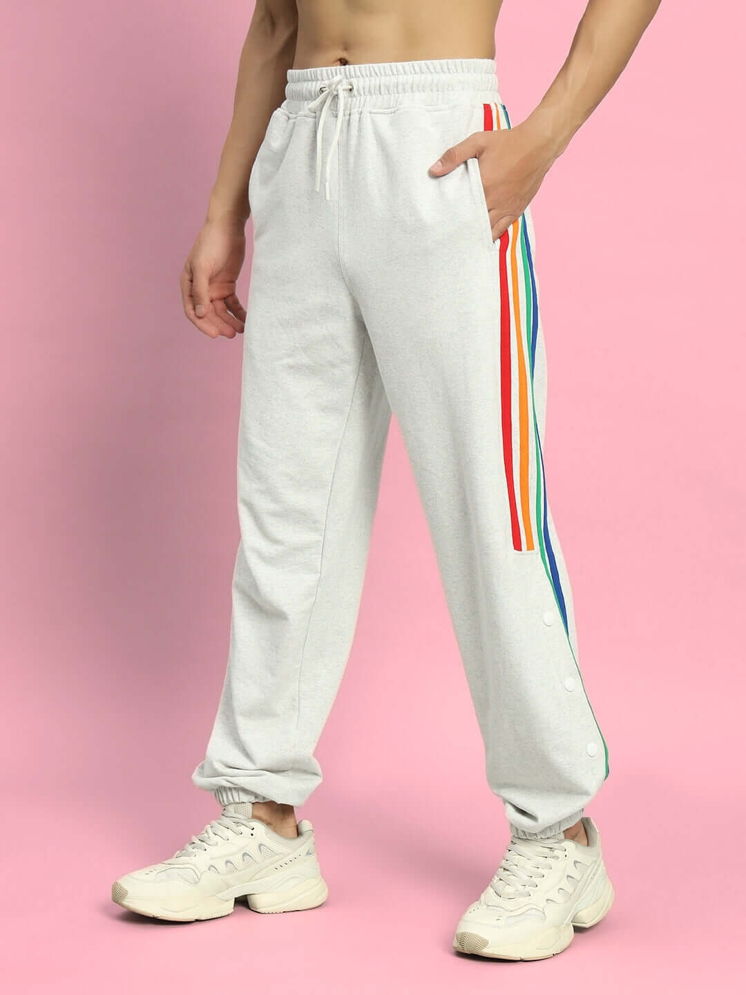 Model wearing DUDS Prism Colorful Stripe Joggers in Melange Grey with rainbow side stripes