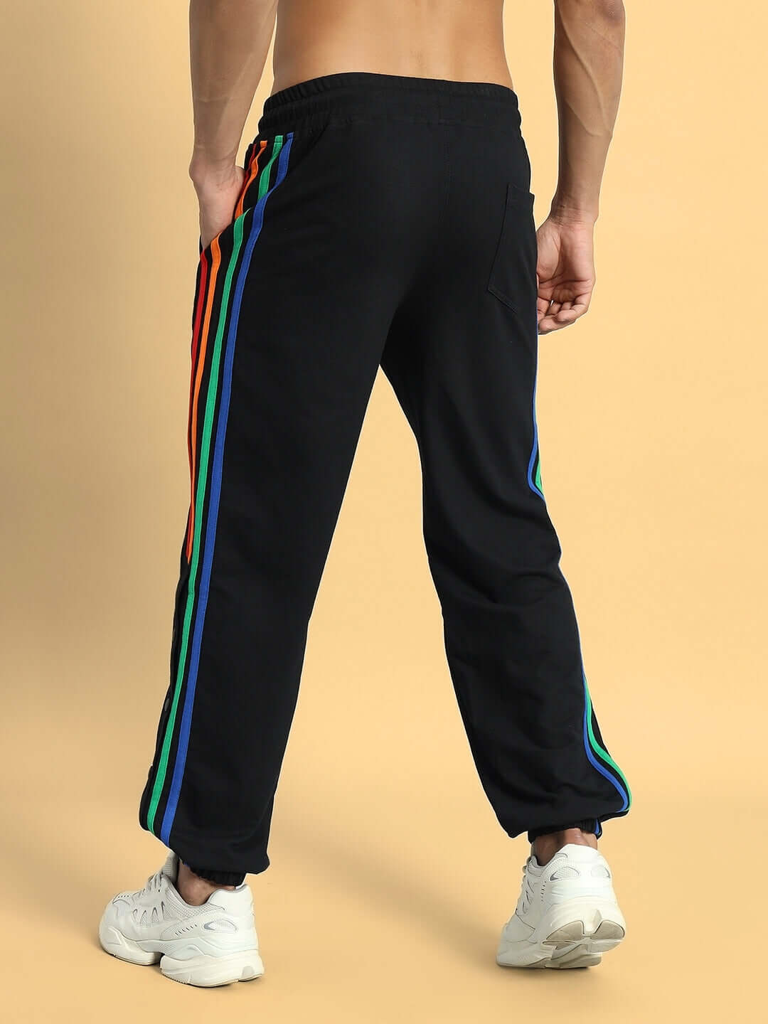 DUDS Prism Colorful Stripe Joggers in black, featuring custom-fit options and vibrant side stripes, showcased by a model from the back view.