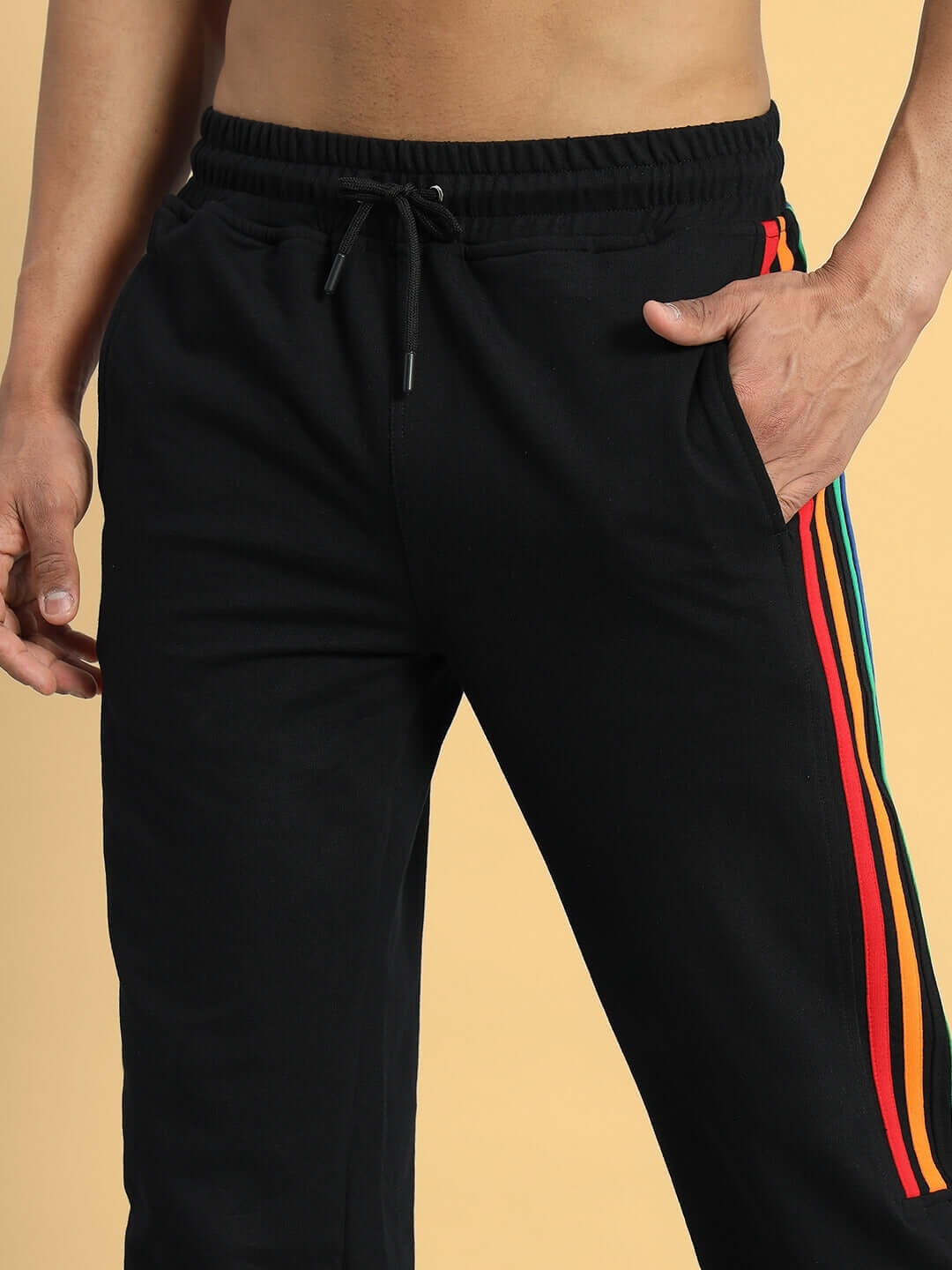 Black joggers with colorful stripe, showcasing DUDS PRISM design. Made to order for perfect fit. Customize size for unique comfort.