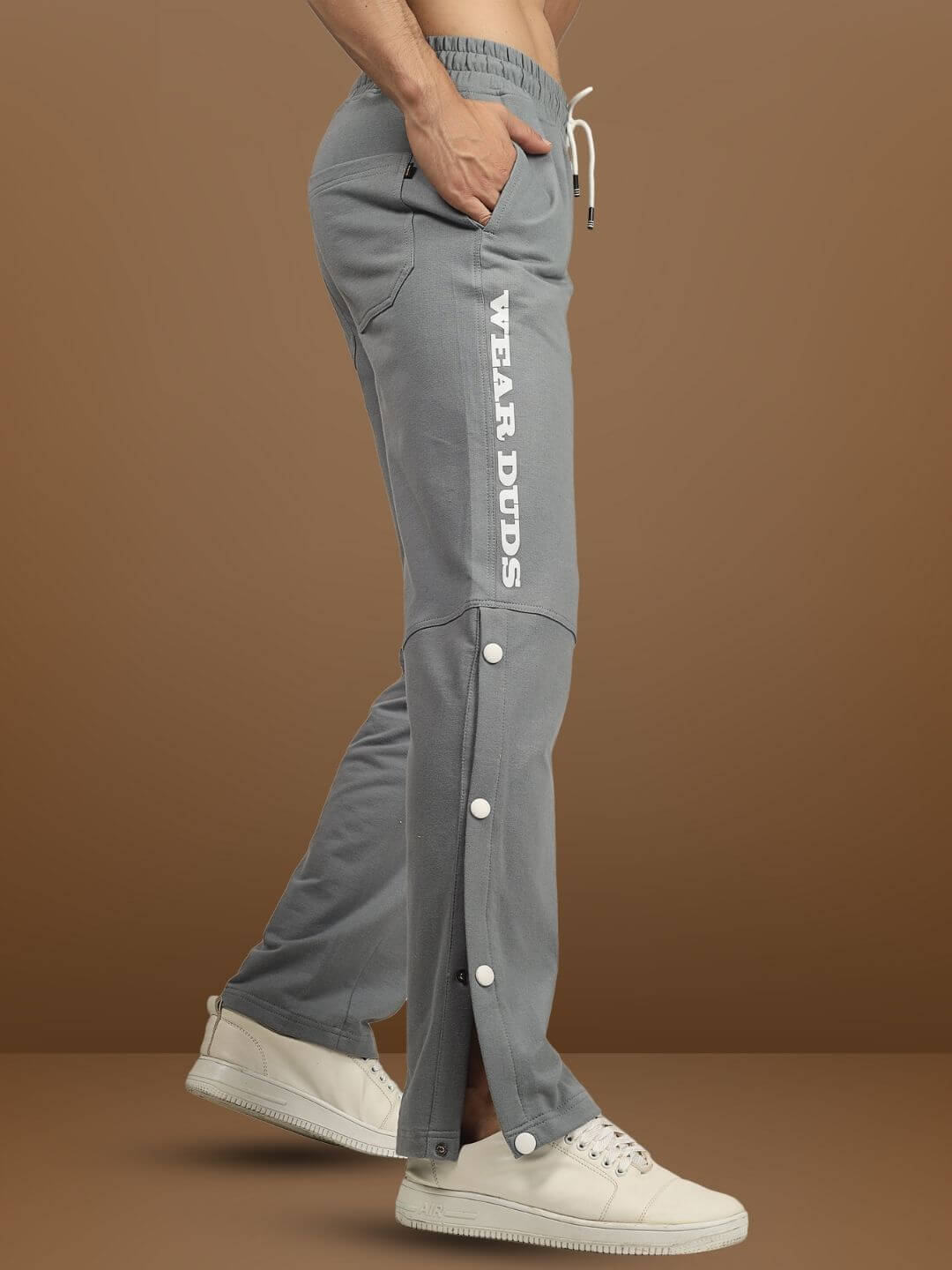 Grey DUDS Racer Joggers with custom fit option, featuring side buttons and logo, perfect for tailored comfort and style.