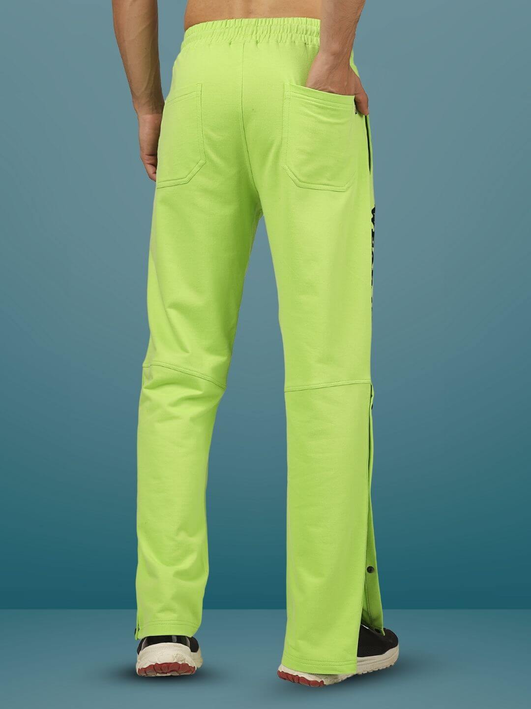 Back view of DUDS Racer Joggers in neon green, featuring pockets and comfortable fit, designed for style and custom fitting.