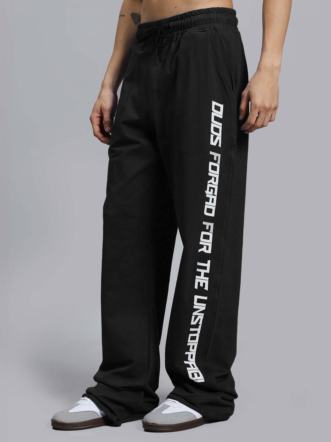 Alt Tag: Black DUDS Swift Jogger with side print, worn by model, emphasizing comfort and style. Available for made-to-order.
