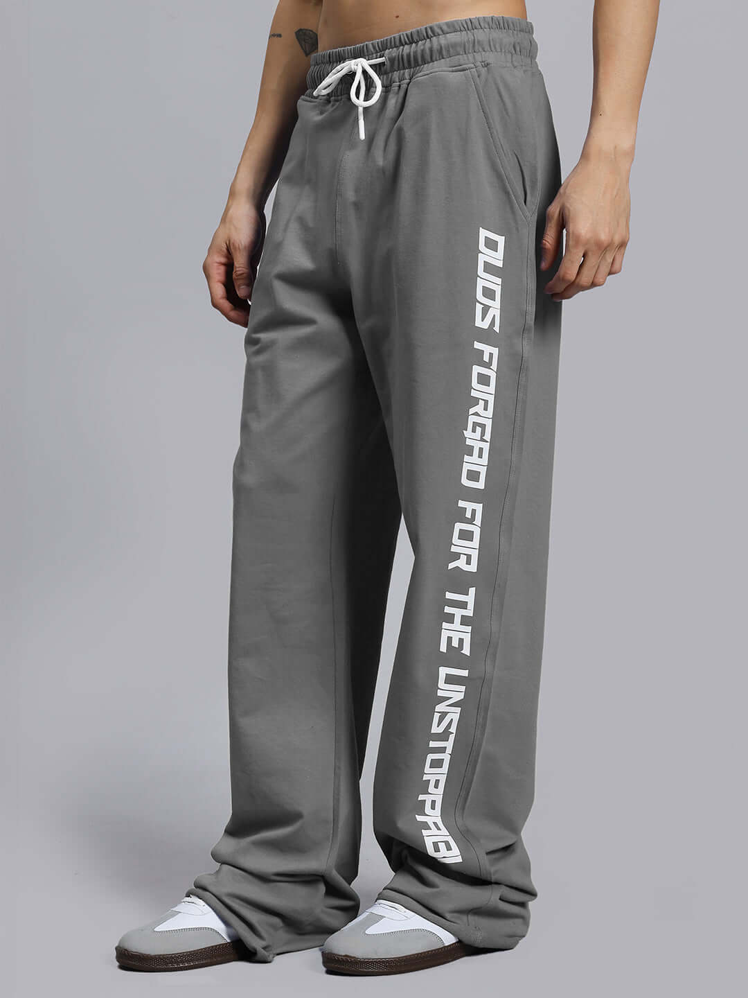 Gray DUDS Swift Jogger pants with "FORGED FOR THE UNSTOPPABLE" printed on the leg, made to order with size customization option.
