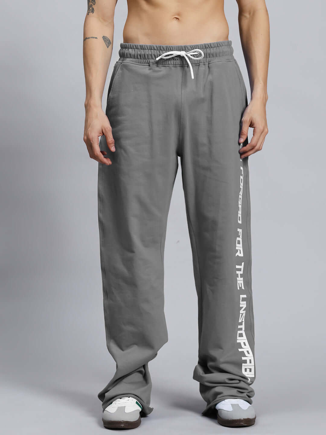 Alt Tag: Men's grey jogger pants by DUDS with elastic waistband and white drawstring, featuring side graphic detailing.