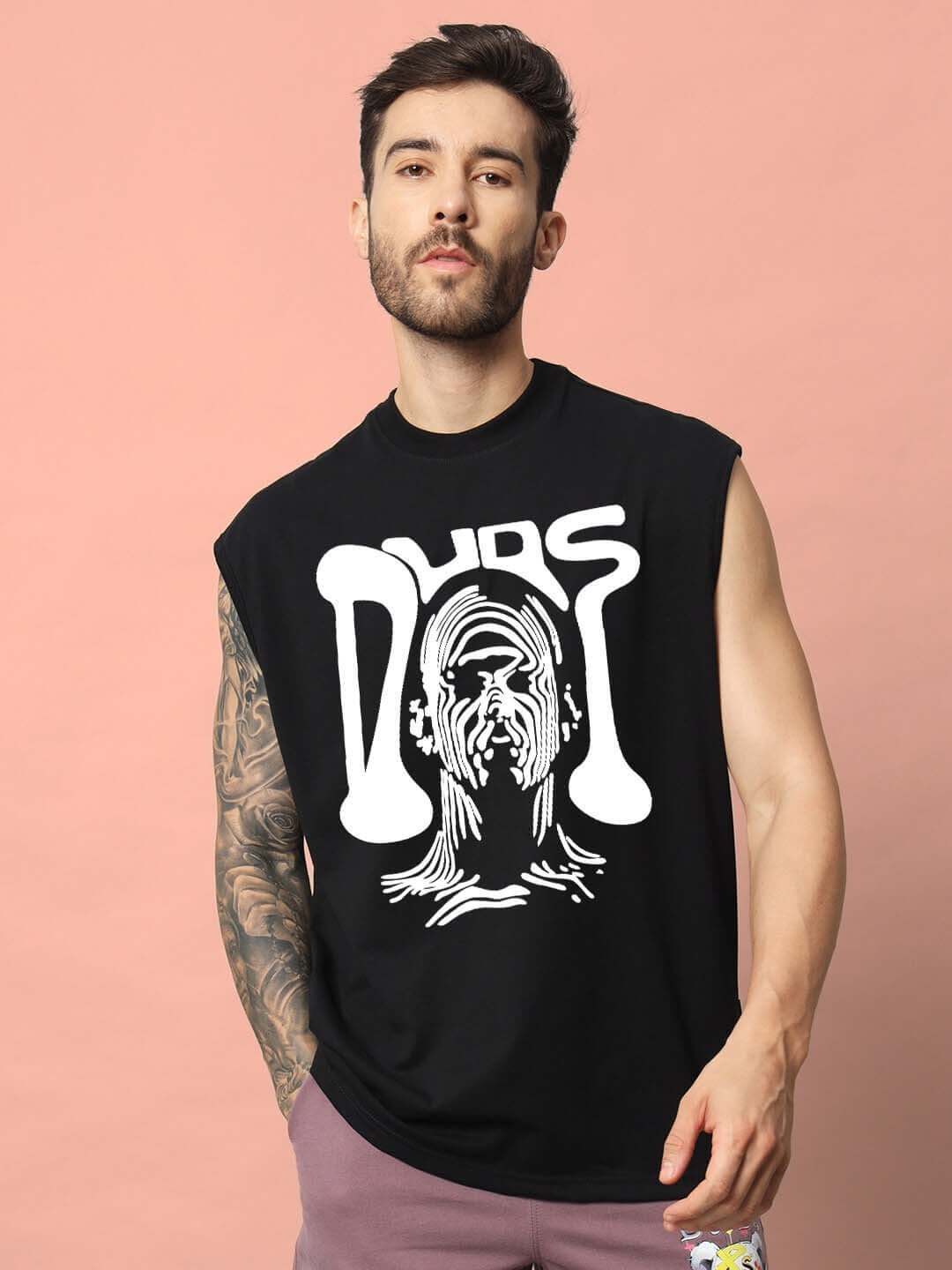 Man wearing DUDS TASKA black gym t-shirt with bold graphic design