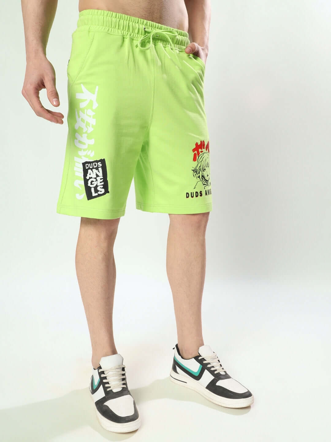 Model wearing DUDS Anime Girl regular fit neon green shorts with sneakers.