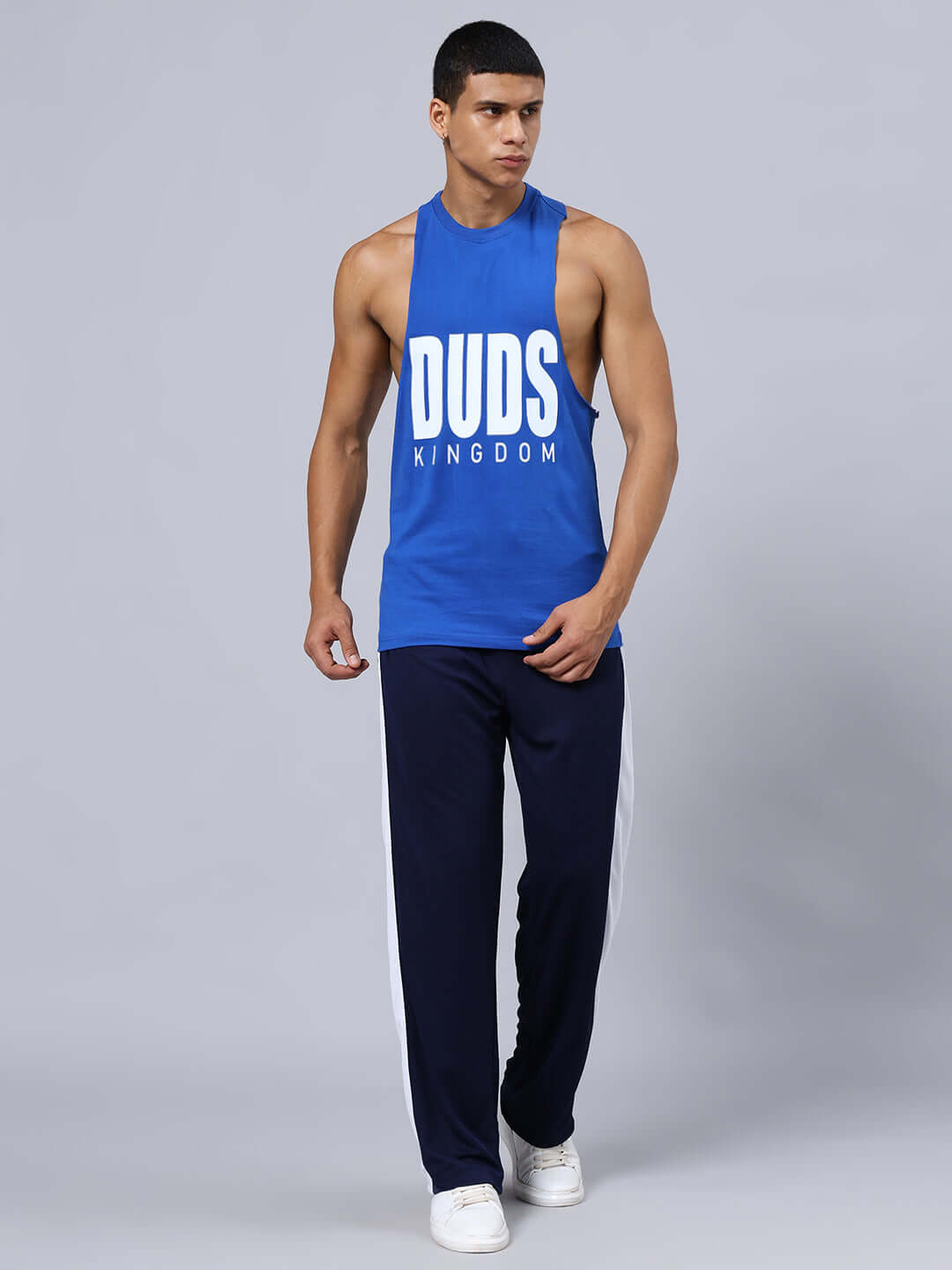 Model wearing DUDS KINGDOM GYM CO-ORD SET BLUE with relaxed fit joggers and cotton top, showcasing elasticated waistband.