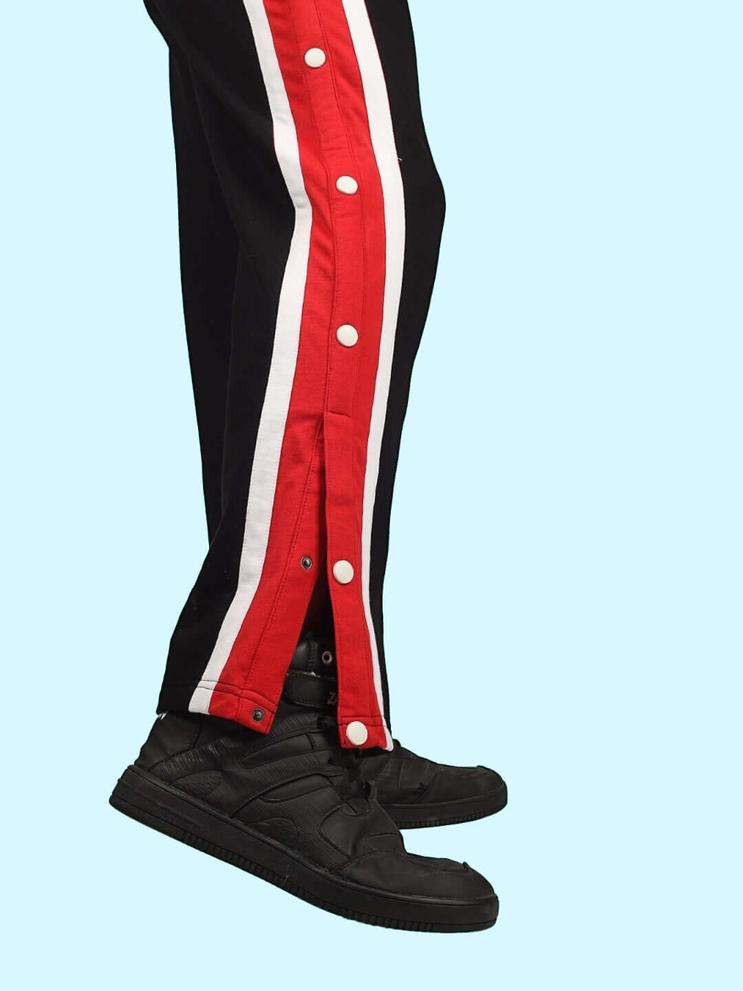 Black DUDS Magician Joggers with red and white snap button detailing and custom fit option, made to order by skilled tailors.