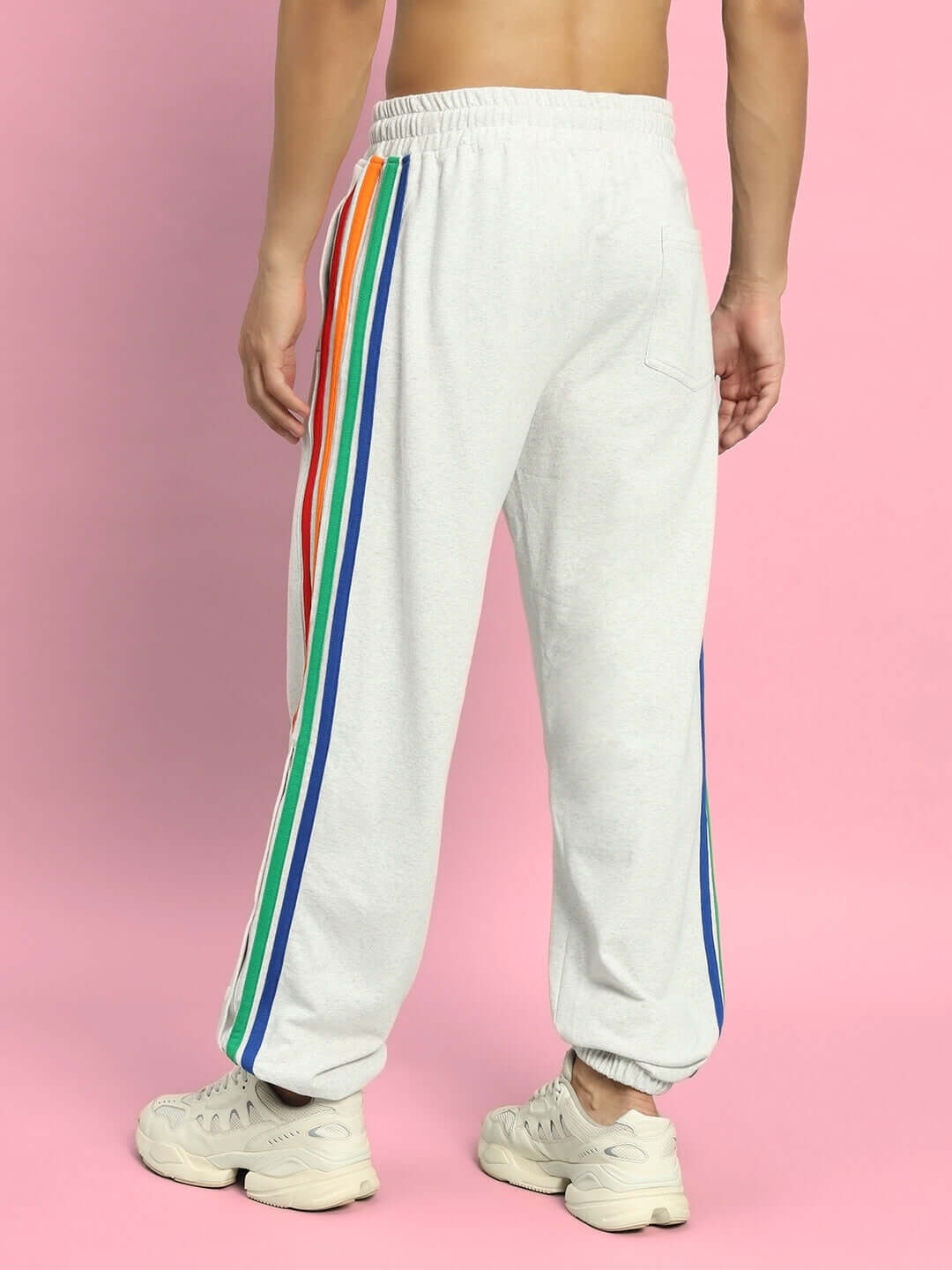 Man wearing DUDS prism colorful stripe joggers in melange grey, featuring rainbow stripes, perfect for custom fit orders.