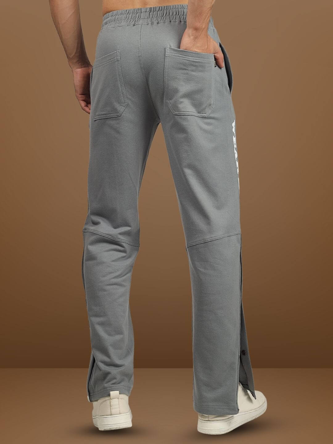Rear view of DUDS Racer Joggers in grey, showcasing comfortable fit and side stripe design, perfect for casual wear and custom sizing options.