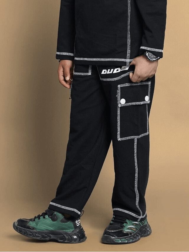 Dynamic oversized co-ord set for boys and girls in black, relaxed fit joggers with pockets, elastic waistband, heavy gauge fabric.