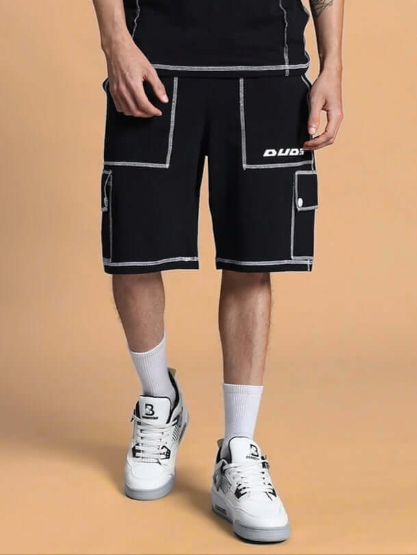 Model wearing Dynamic Regular Fit Black Shorts by DUDS with custom fit option available, showcasing stylish design and comfort.