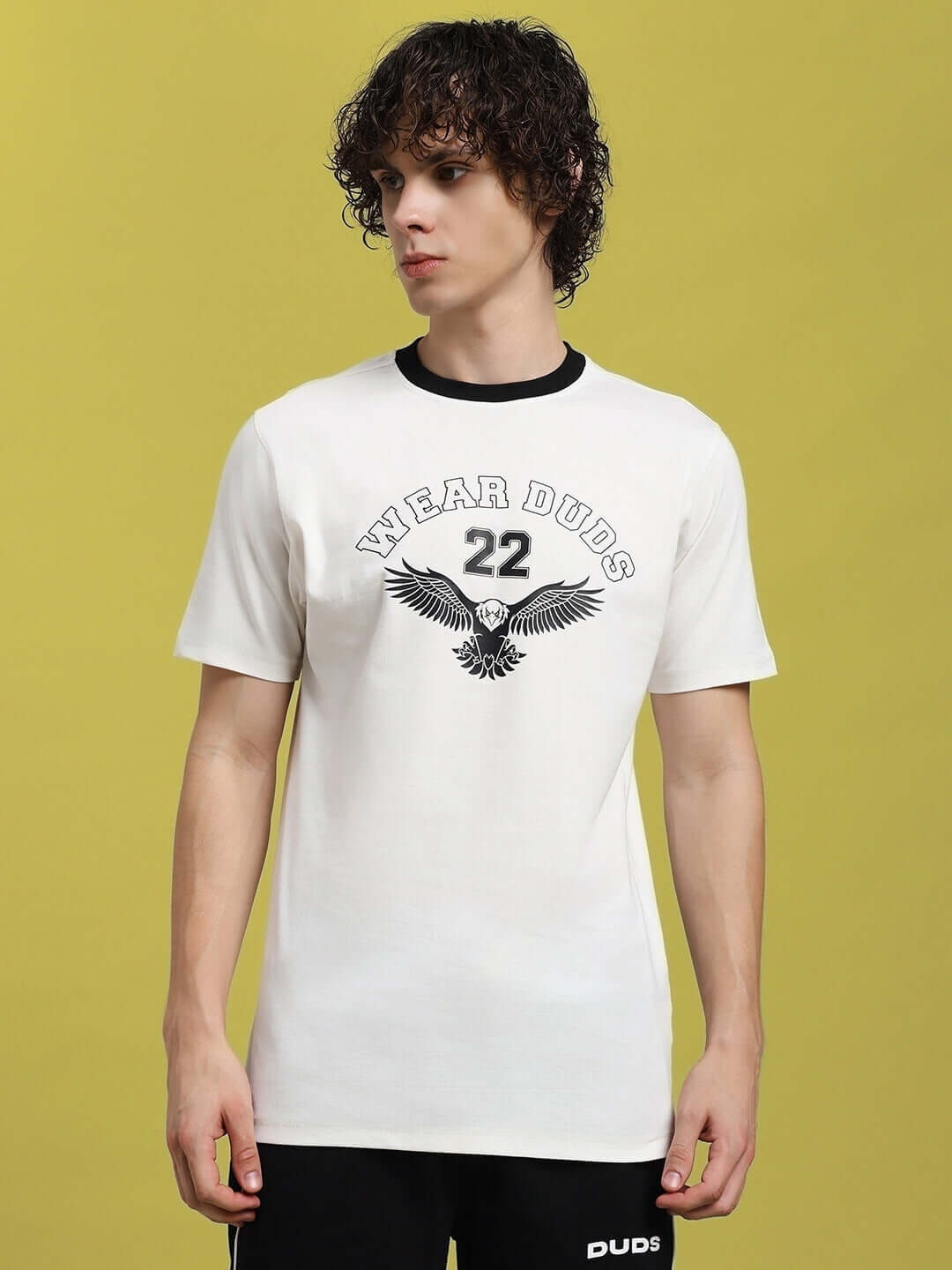 Model wearing Eagle Wings regular fit white T-shirt, 100% cotton, featuring eagle graphic. Premium heavy gauge fabric. Made in India.