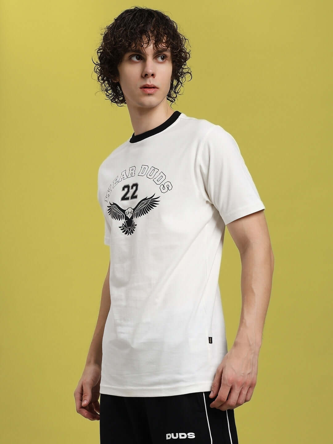 Model wearing Eagle Wings white regular fit t-shirt, made of 100% cotton, showcasing shirt design with eagle graphic. Made in India.