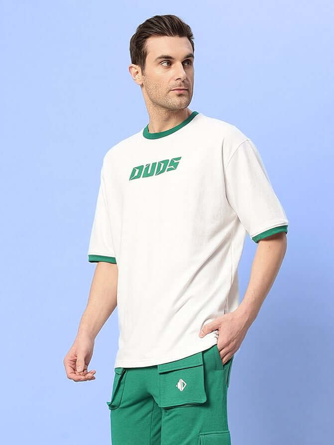 Model wearing Easton Boxy Fit T-Shirt White-Green, showcasing casual style and comfort.