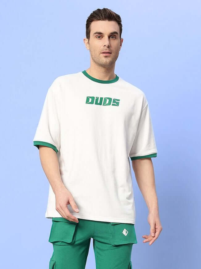 Model wearing EASTON BOXY FIT T-SHIRT WHITE-GREEN with green collar and sleeves.