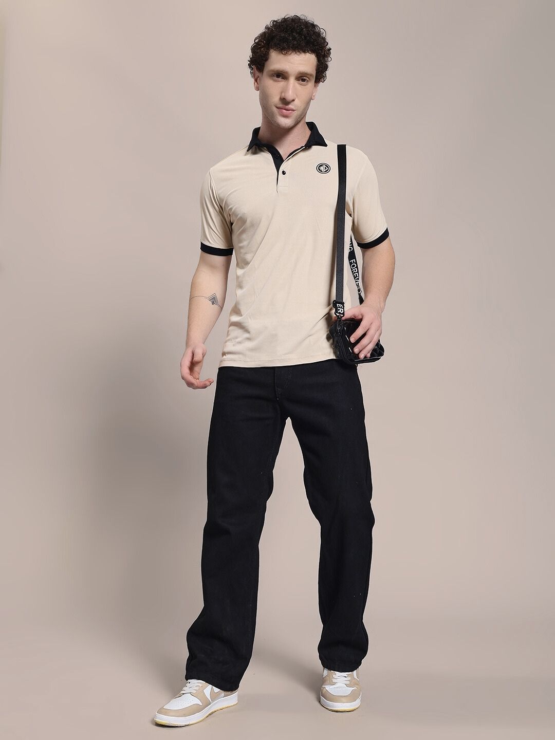 Man wearing EDGE POLO REGULAR FIT T-SHIRT BEIGE BLACK, showcasing a stylish combination of classic and modern streetwear