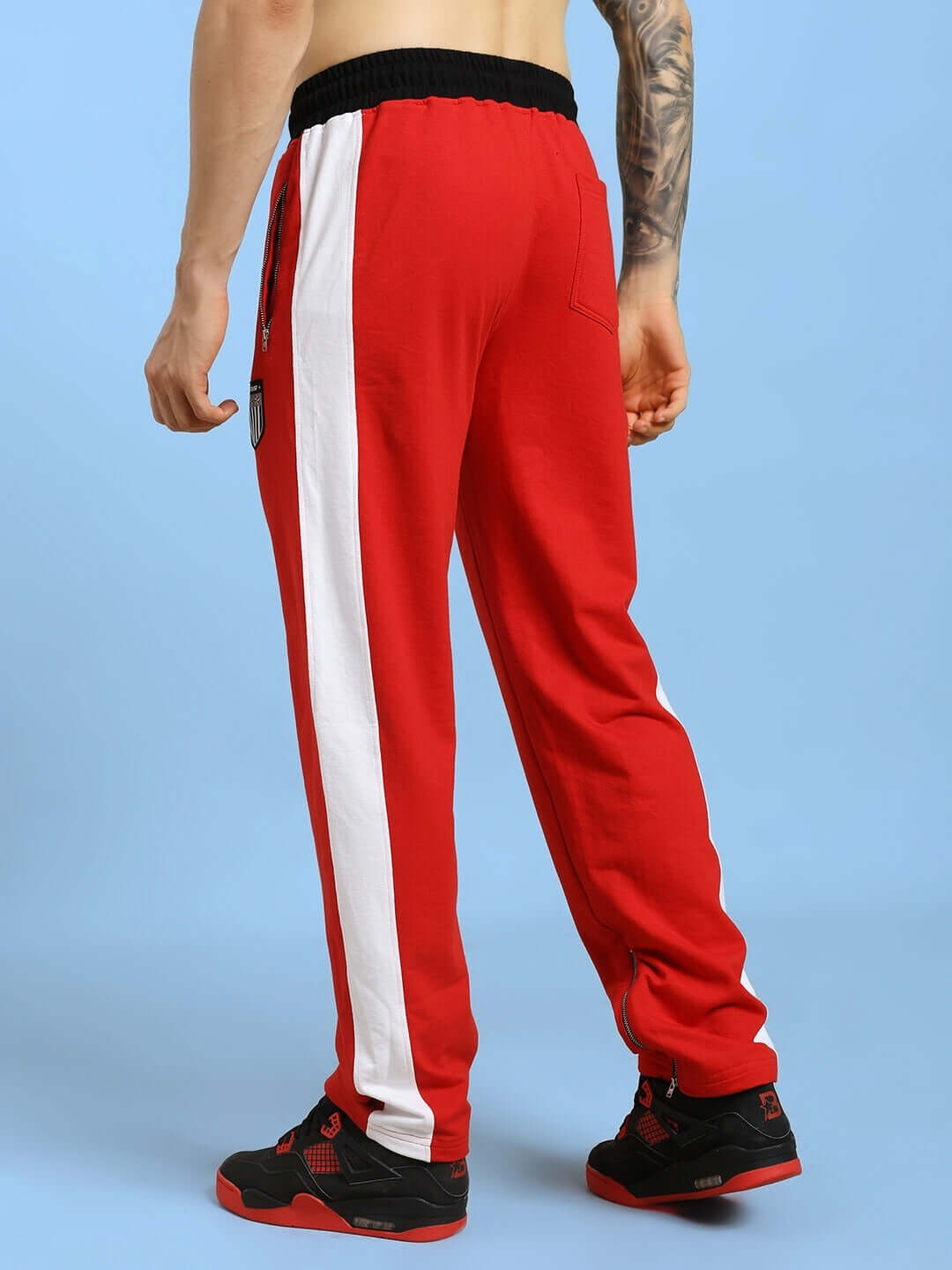 Back view of ELEGANT RELAXED-FIT JOGGERS RED with white side stripe, showcasing comfortable and stylish design.