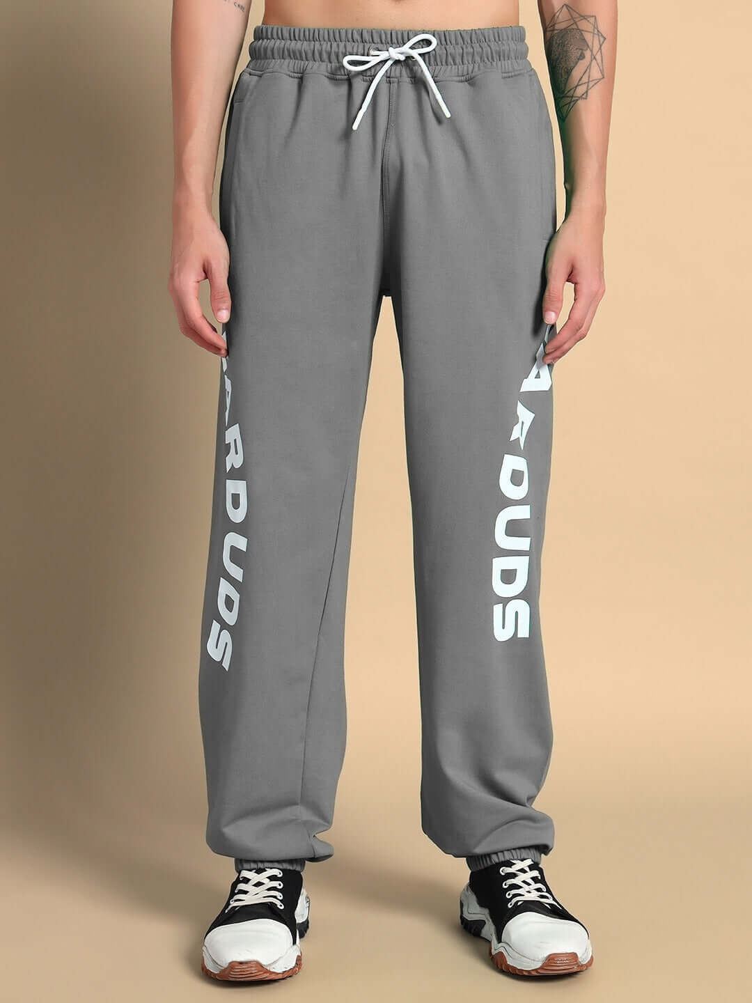 Model wearing grey ELLEN RELAXED FIT JOGGER by DUDS with customizable size option, made to order with premium tailoring.