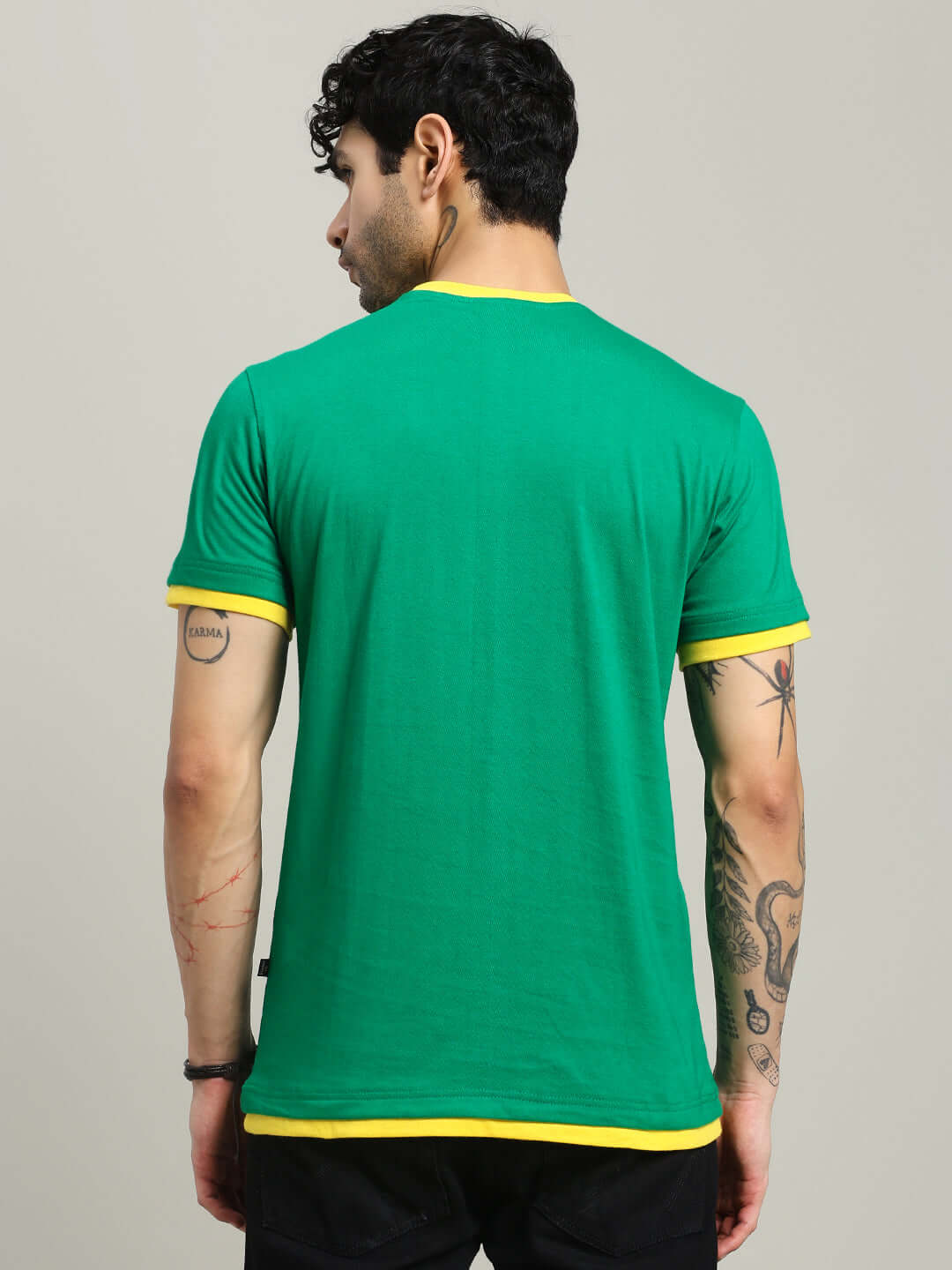 Back view of a model wearing an Elmer regular fit green T-shirt with yellow trim, made from premium 100% cotton fabric, 190 GSM.