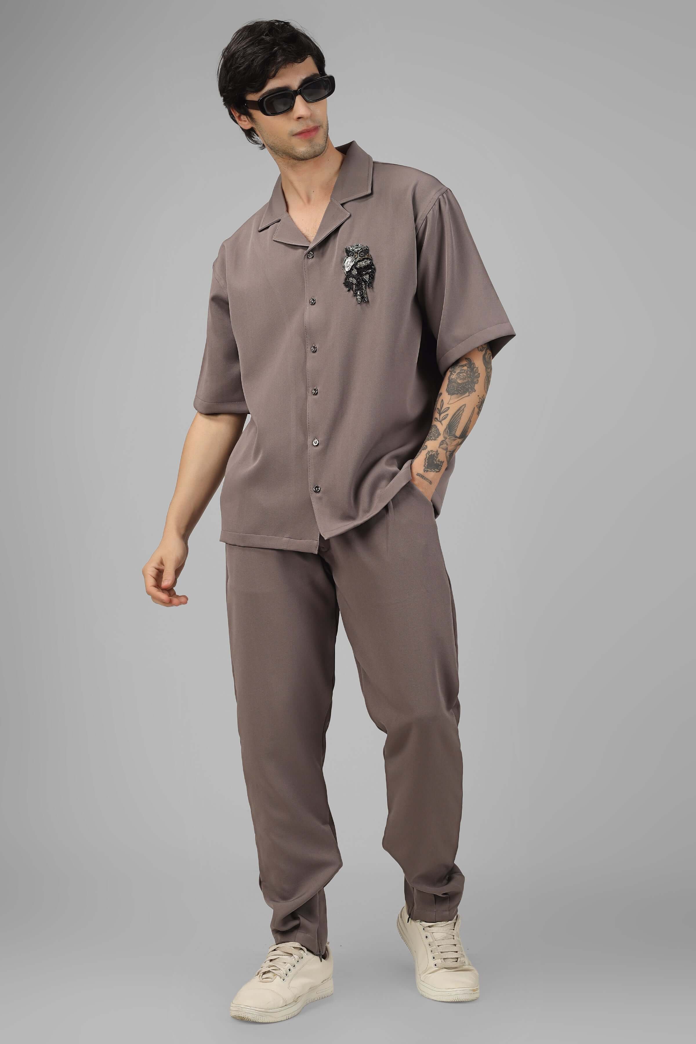Model in a relaxed fit embellished owl co-ord set featuring half sleeve shirt and pants made of stretchable banana crepe fabric by DUDS