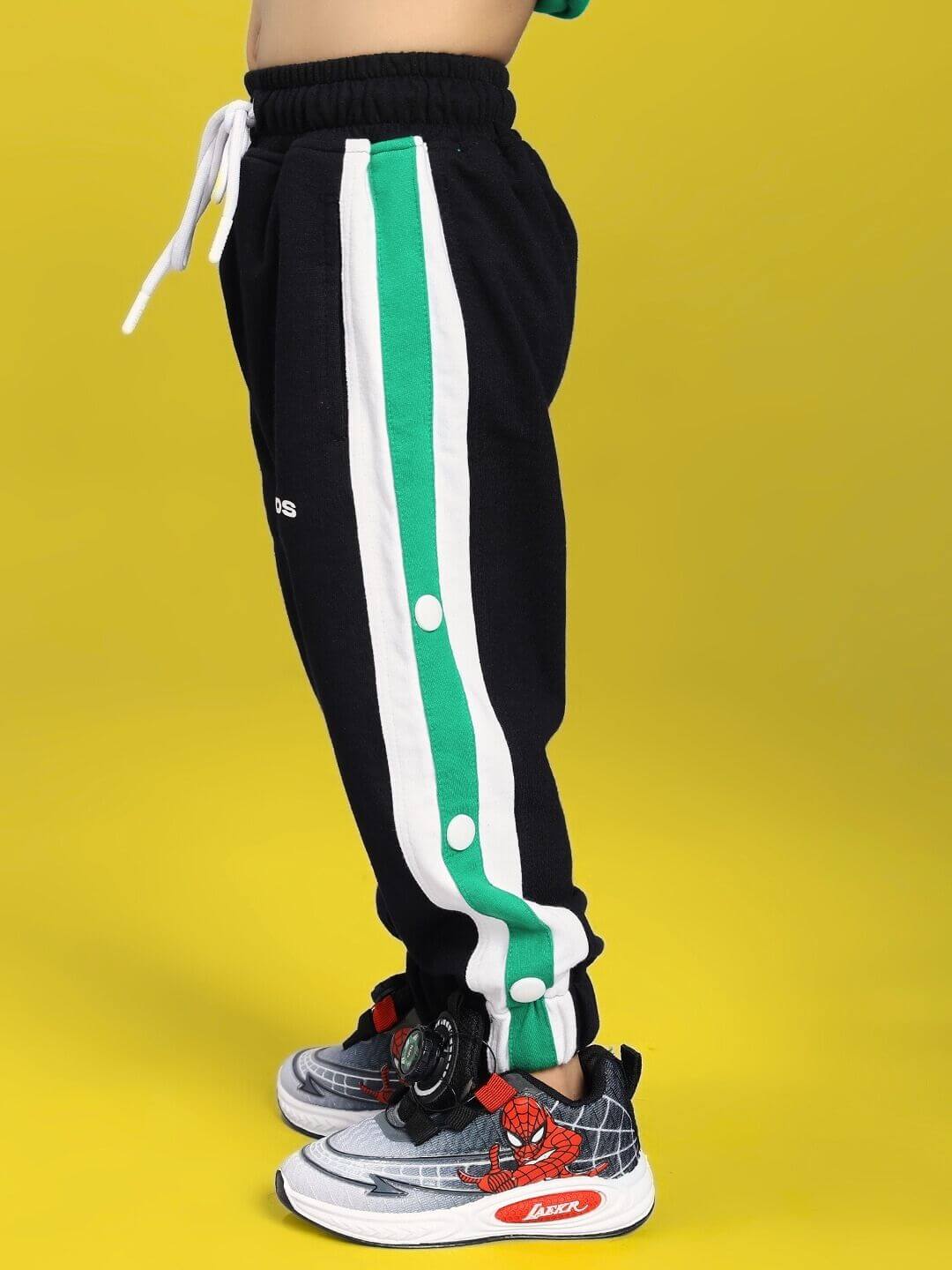EMIRATI JOGGER FOR BOYS AND GIRLS BLACK GREEN with green and white stripes on yellow background