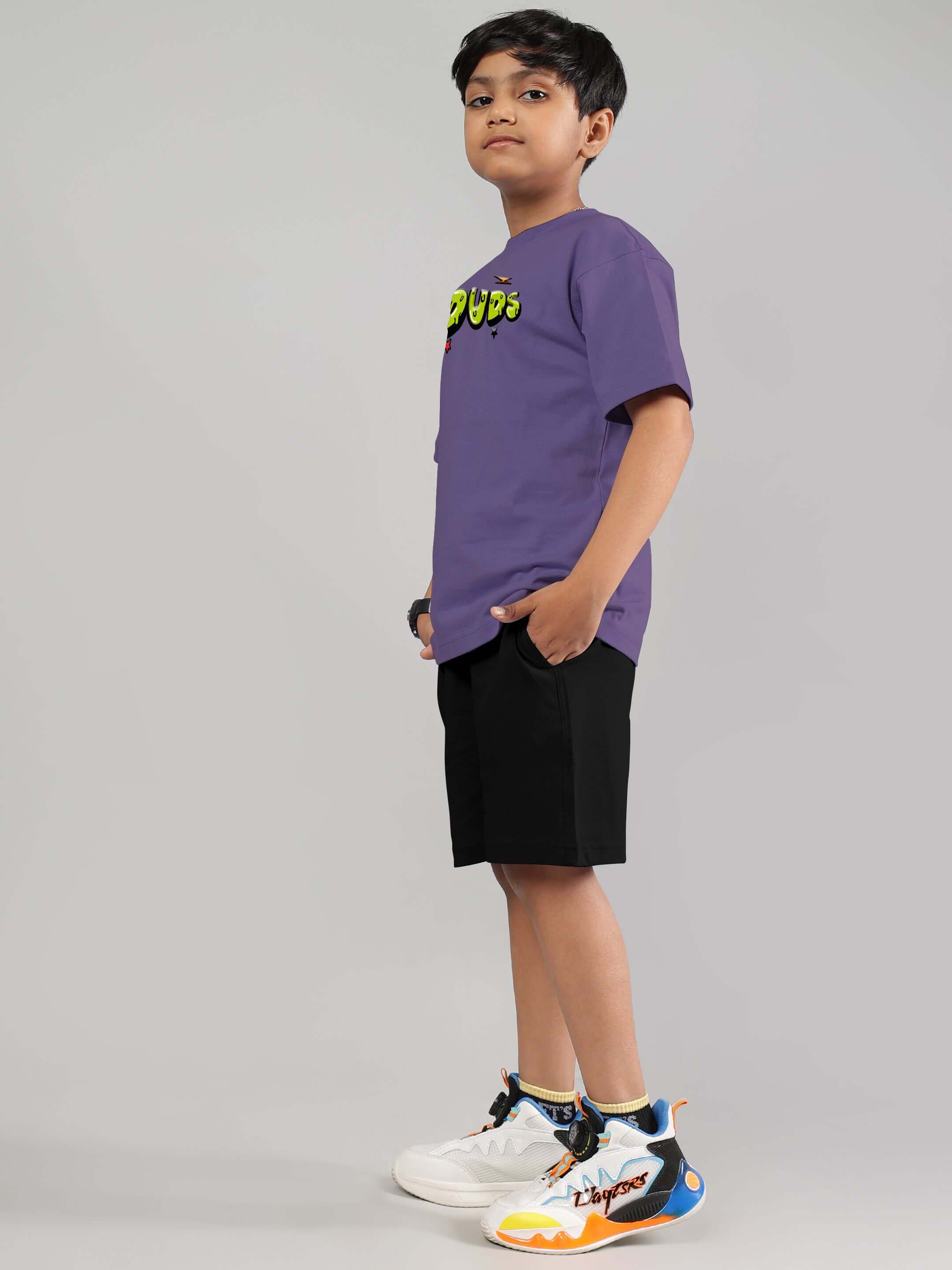 ESCAPED TWEETY CO-ORD FOR BOYS GIRLS WISTERIA PURPLE BLACK set modeled by boy in purple top and black shorts
