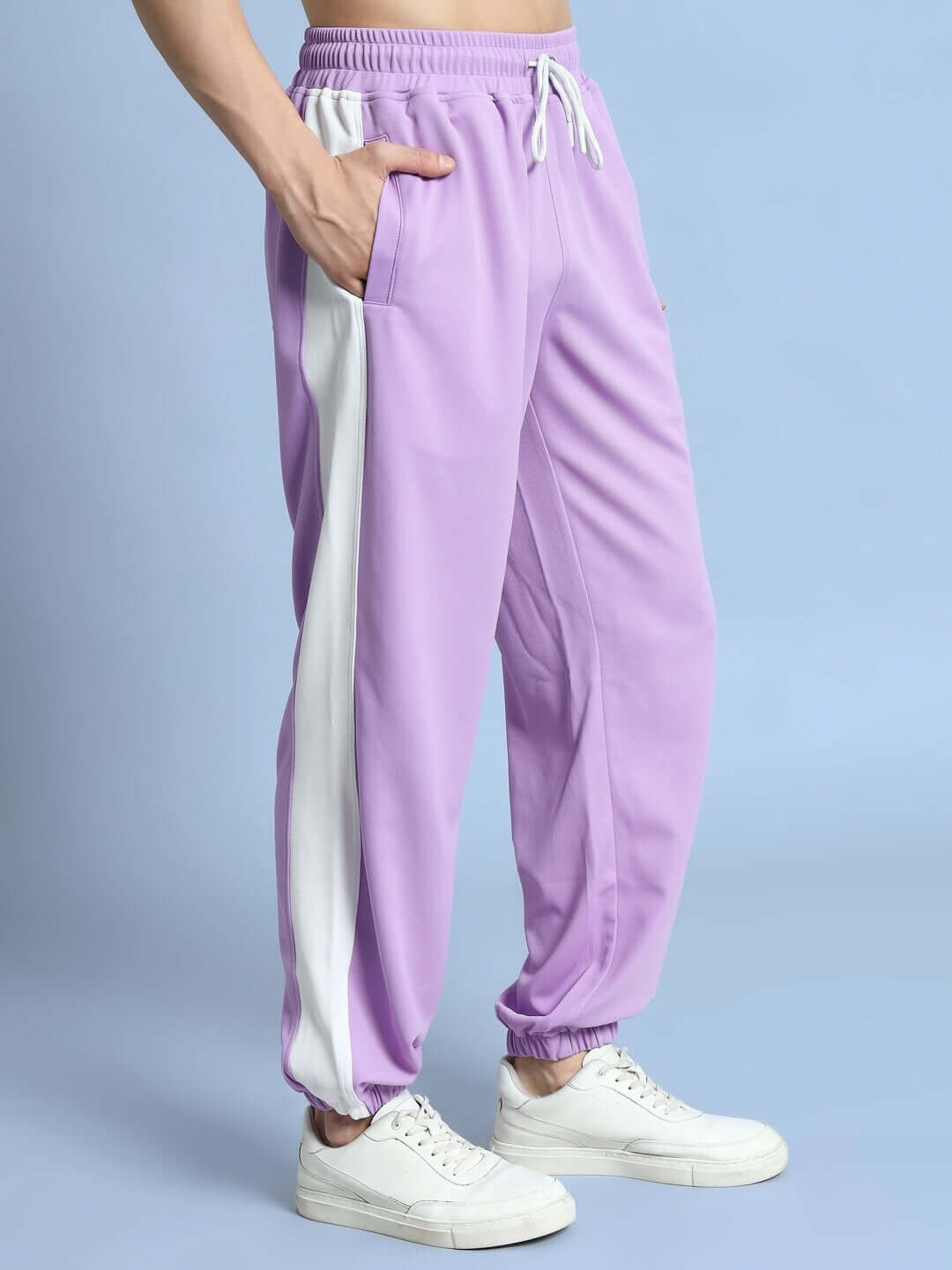 Lavender-white Euphoria joggers with custom fit option; made to order by skilled tailors; shown with casual white sneakers.