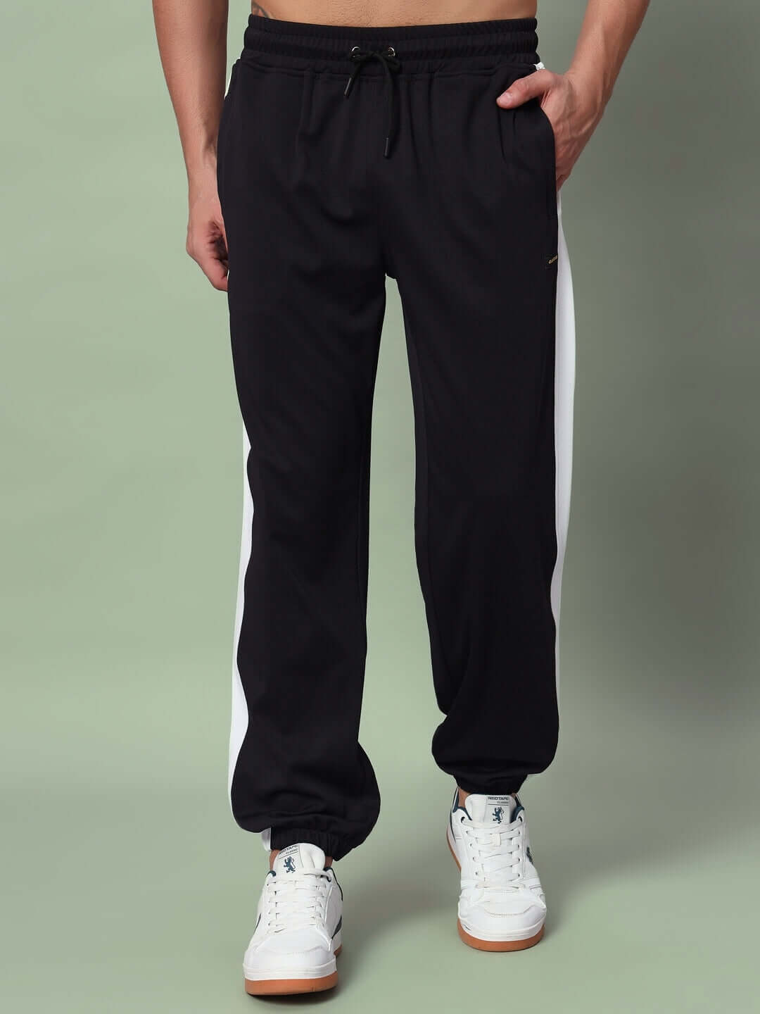 EUPHORIA joggers in black and white, featuring comfortable design, tailored fit, and customizable options by DUDS Tailors.
