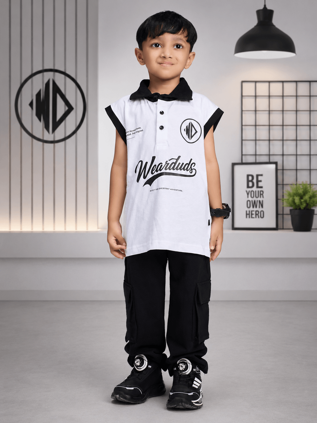 EVERYDAY ADVENTURE JOGGER FOR BOYS GIRLS BLACK worn by a boy in a stylish outfit with a black backdrop.