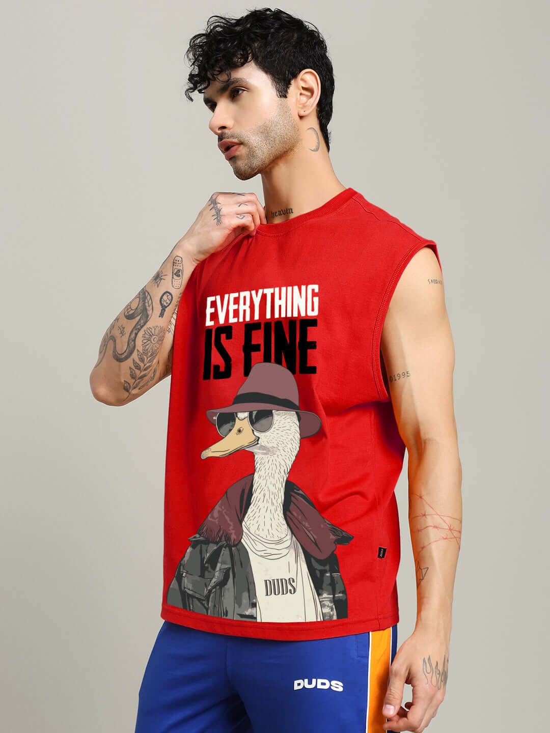 Man wearing red "Everything is Fine" gym t-shirt, featuring a stylish graphic design, perfect for fitness enthusiasts looking for custom fits.