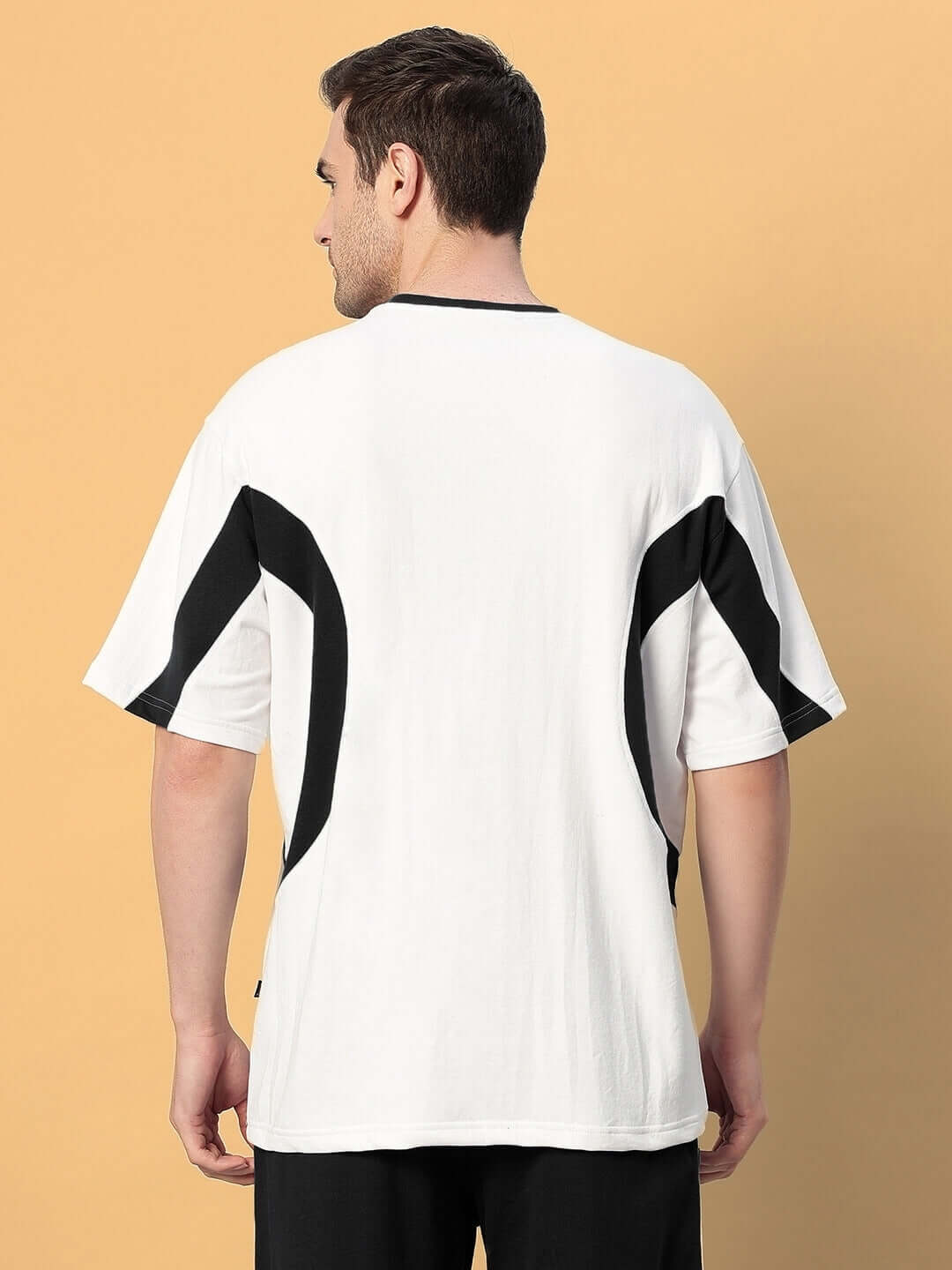 Back view of EZEL OVER-SIZED T-SHIRT BLACK WHITE in breathable cotton, featuring bold streetwear style for men.
