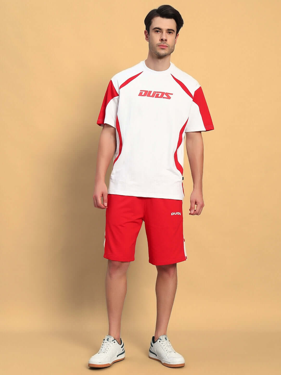 Model wearing EZEL REGULAR FIT COTTON SHORTS RED, showcasing casual and vibrant style suitable for sunny weekends.
