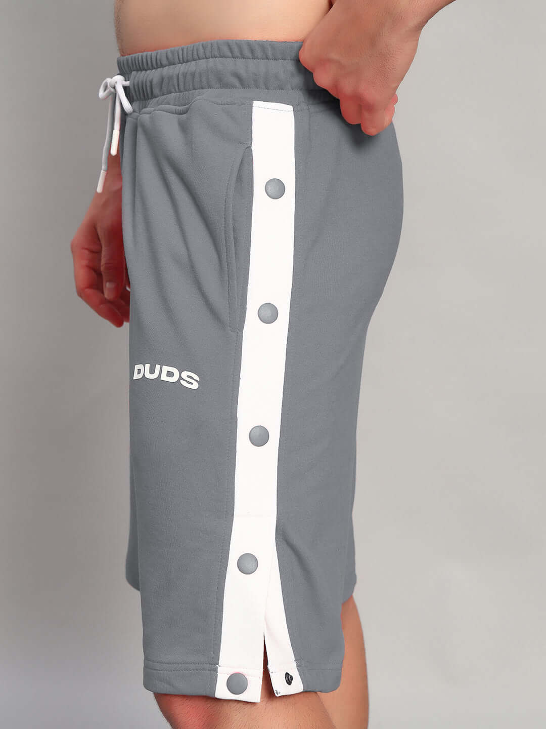 Side view of EZEL REGULAR FIT COTTON SHORTS GREY with button detailing, perfect for casual wear.