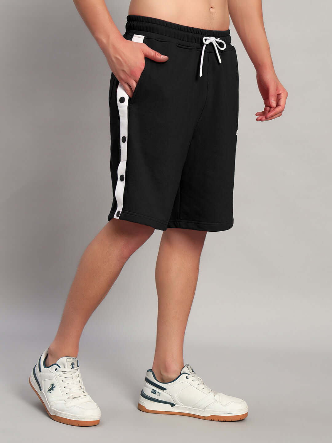 Ezel Regular Fit Shorts Black cotton fabric with side buttons and drawstring waistband, perfect for modern streetwear style by WEAR DUDS.
