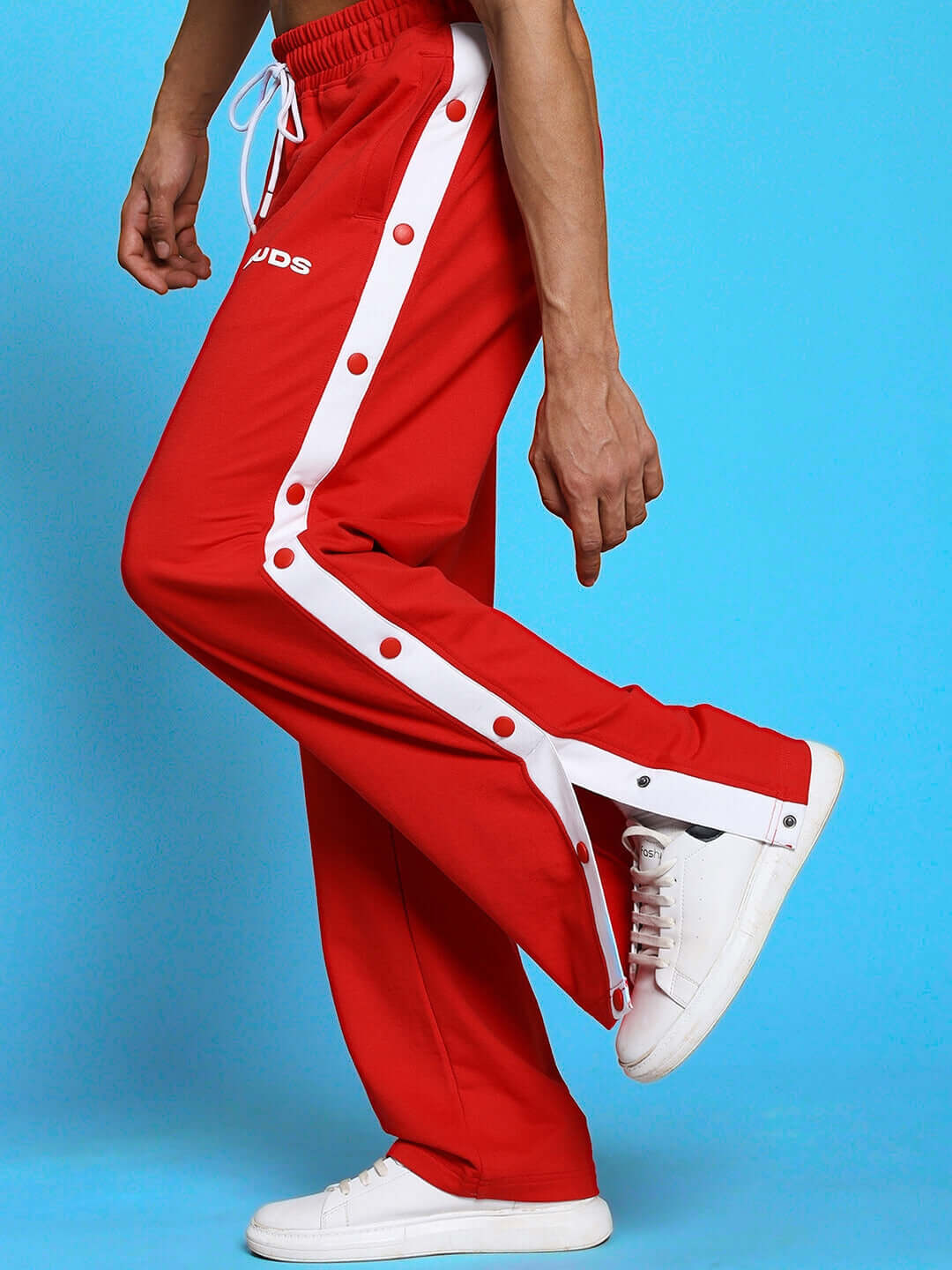 EZEL RELAXED FIT CO-ORD SET WHITE-RED pants in red and white, breathable cotton, unisex design, showcasing side button detail.