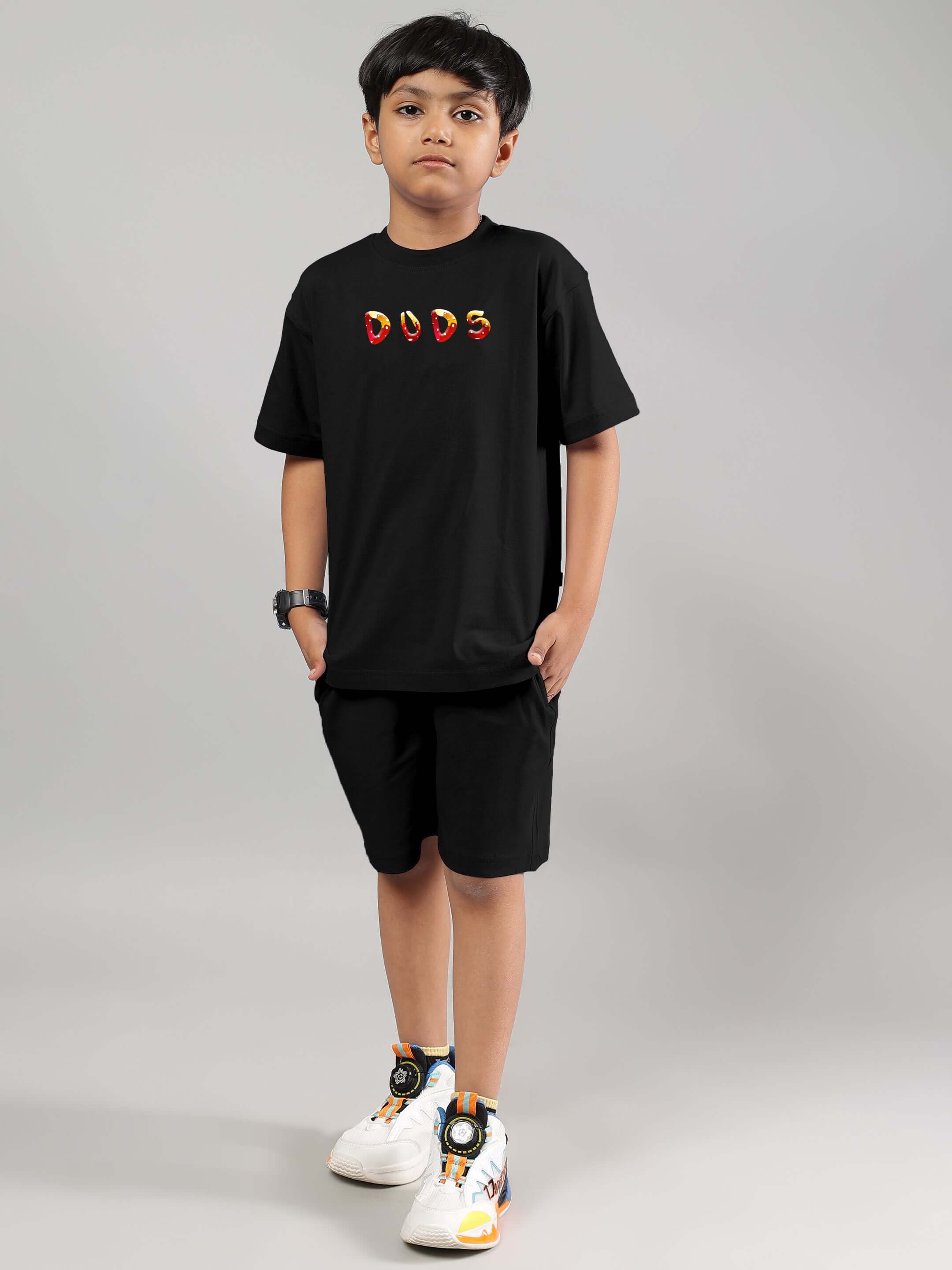Child wearing black DUDS fantasy mushroom co-ord set, featuring t-shirt and shorts, suitable for boys and girls. Made to order.