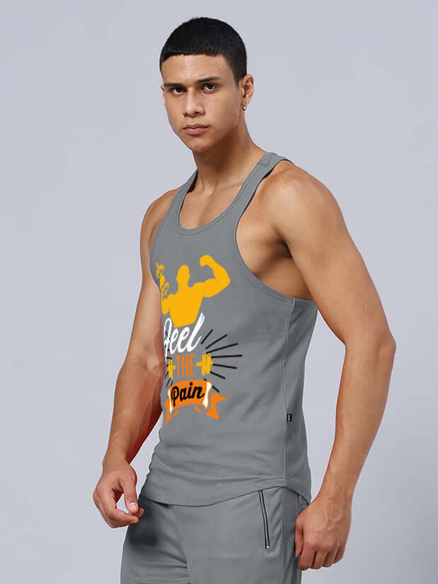 Man wearing FEEL THE PAIN PRINTED GYM T-SHIRT GREY, showcasing muscle design, fitness attire for workouts, customizable fit available.