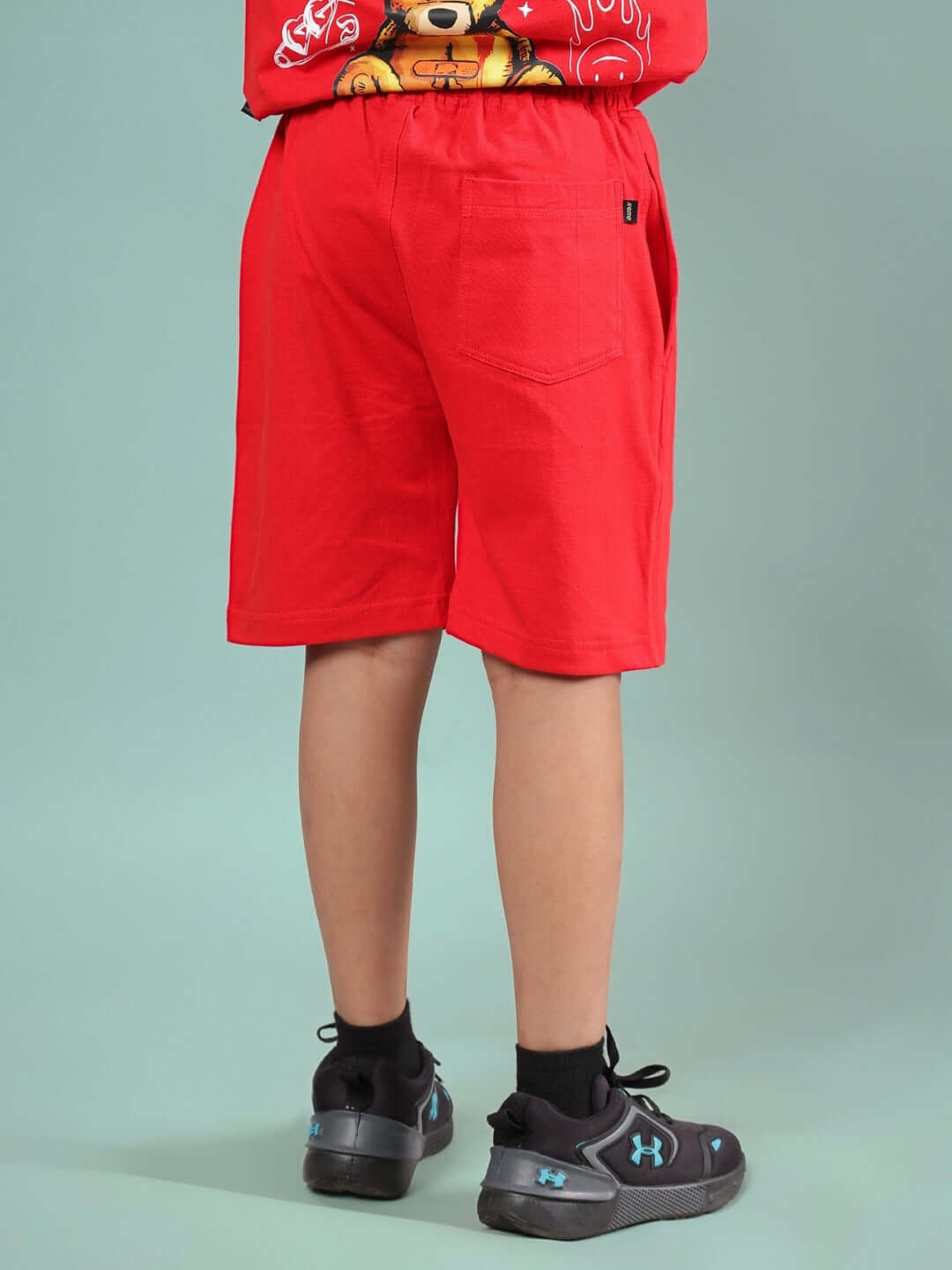 FEELS NOTHING SHORTS FOR BOYS & GIRLS RED shown from the back, highlighting casual fit and vibrant color, suitable for customization.