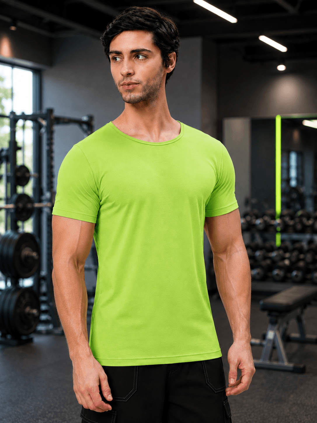 Man wearing BEDROCK FIT REGULAR FIT T-SHIRT NEON GREEN in a gym setting, showcasing vibrant color and fit.