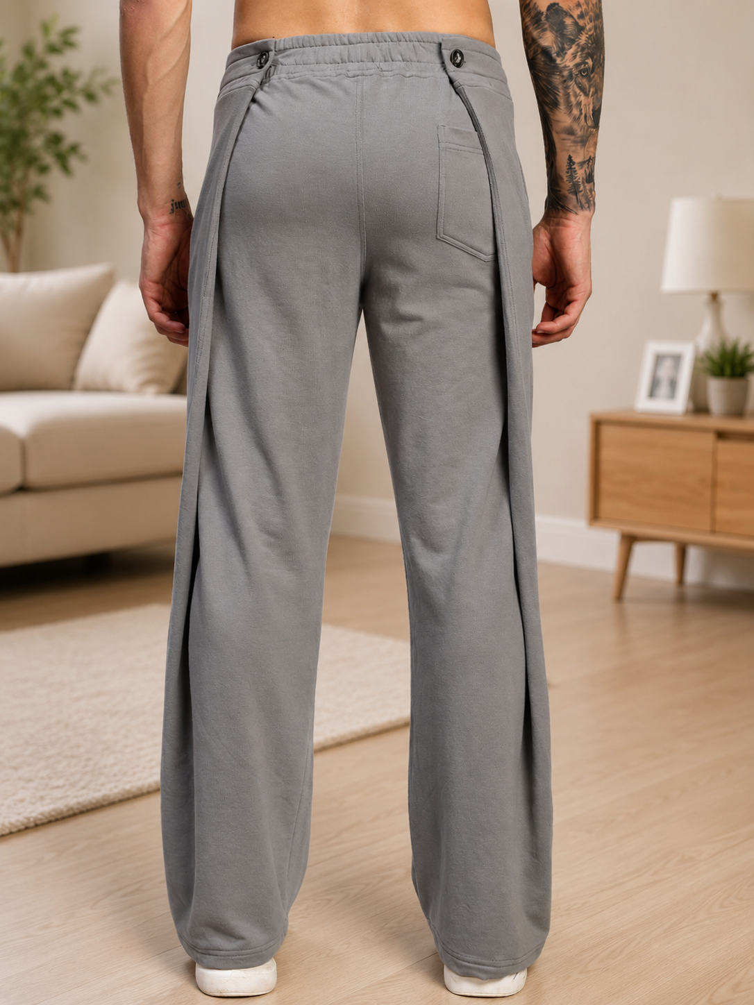 Back view of a man wearing OMEGA FLOW WIDE FIT JOGGERS GREY, showcasing relaxed wide-fit design and modern streetwear style.