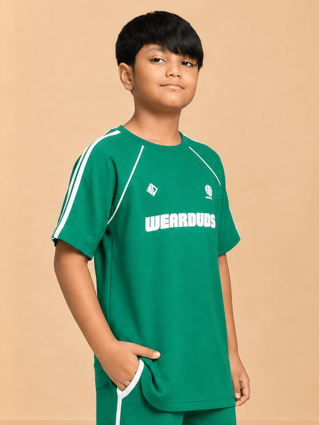 KIDS ROSTER T-SHIRT BOYS GIRLS GREEN WHITE worn by a boy in a green shirt with white accents.