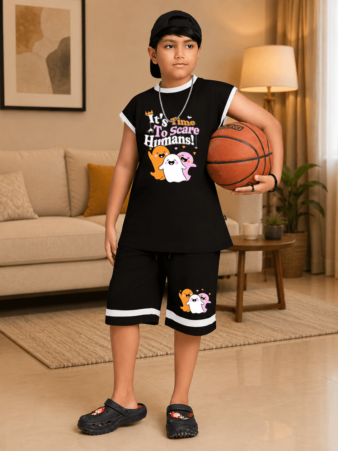 HALLOWEEN GRAPHIC PRINT CO-ORD FOR BOYS GIRLS BLACK featuring a boy holding a basketball in a spooky outfit.