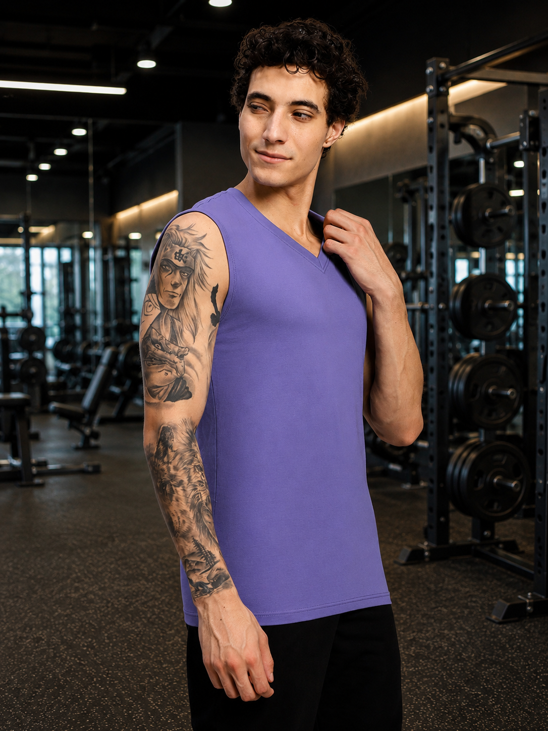 LEVELUP GAMER SLEEVELESS T-SHIRT PURPLE worn by a young man in a gym setting, showcasing a modern and stylish design.