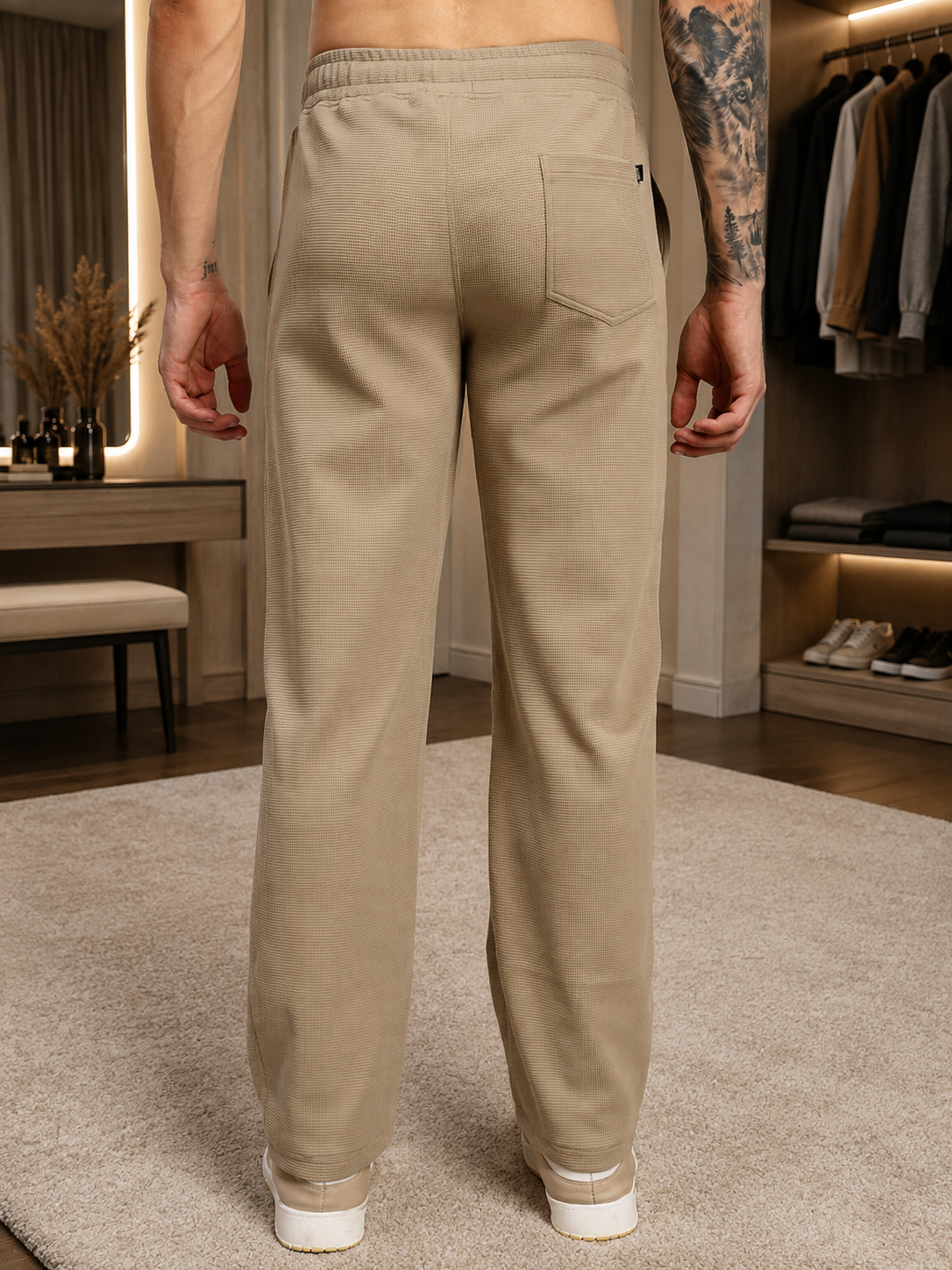 ELITE TEXTURED FIT JOGGERS BEIGE shown from the back, featuring a tailored fit and soft beige color.