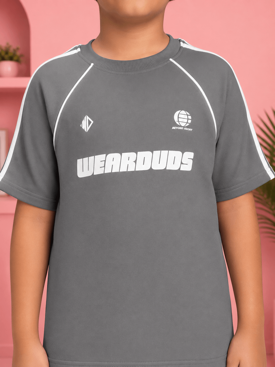 KIDS ROSTER CO-ORD BOYS GIRLS GREY WHITE boy wearing grey t-shirt with WEARDUDS logo in a stylish setting