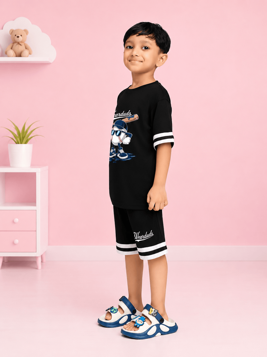 MASCOT GRAPHIC CO-ORD SET FOR BOYS GIRLS BLACK WHITE modeled by a boy in playful black outfit with mascot graphic.
