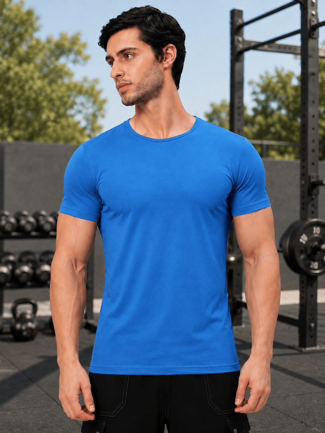 BEDROCK FIT REGULAR FIT T-SHIRT ROYAL BLUE worn by a man in a gym setting.