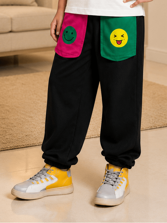 EMOJI VIBES JOGGER FOR BOYS GIRLS BLACK with colorful emoji pockets and stylish sneakers.